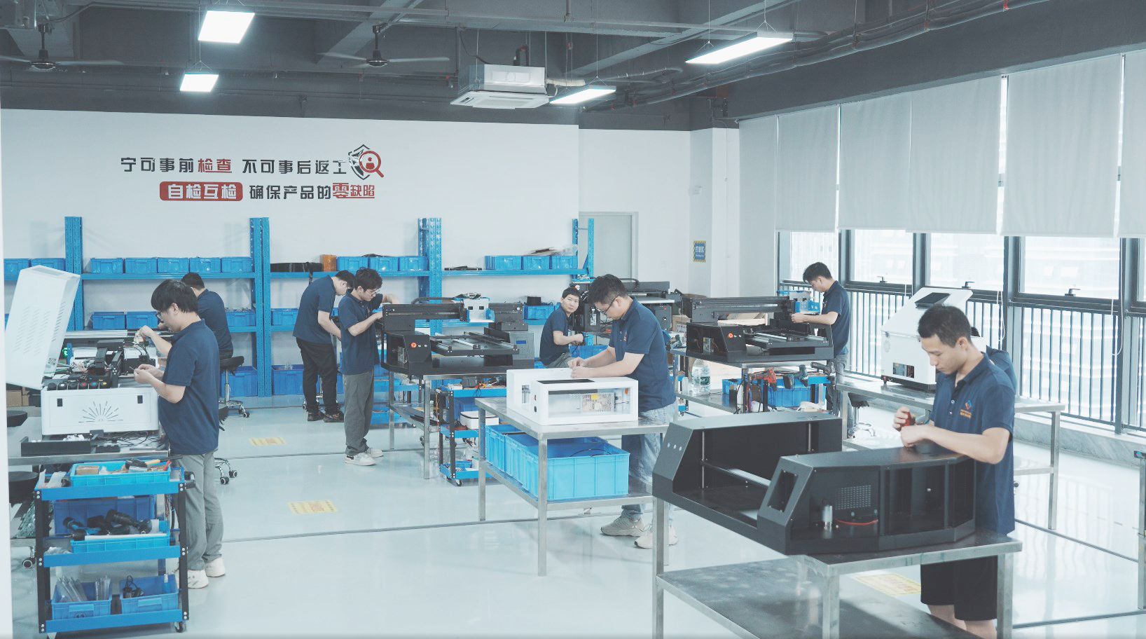 Image of a Chinese UV printer production workshop, where teams conduct self-inspection and mutual inspection to ensure zero-defect chinese UV printers. The facility emphasizes "pre-inspection over rework" to deliver high-quality chinese UV printing equipment.