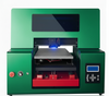 small UV printer with open bed, red mechanism, and digital control panel. Ideal for small businesses printing high-resolution designs on materials like leather and plastic.