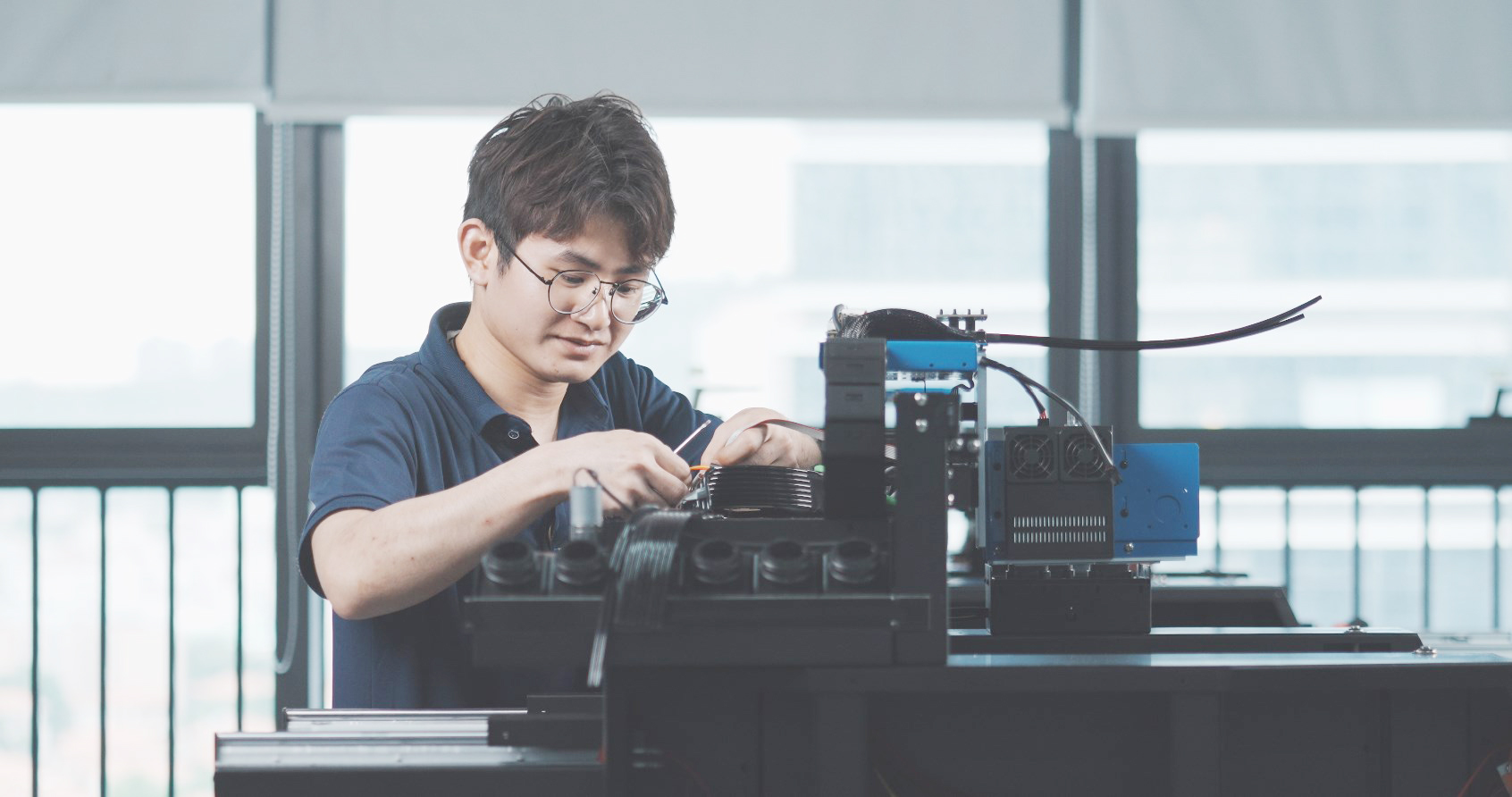 Engineer assembling high-performance uv printer dtf machine with precision components